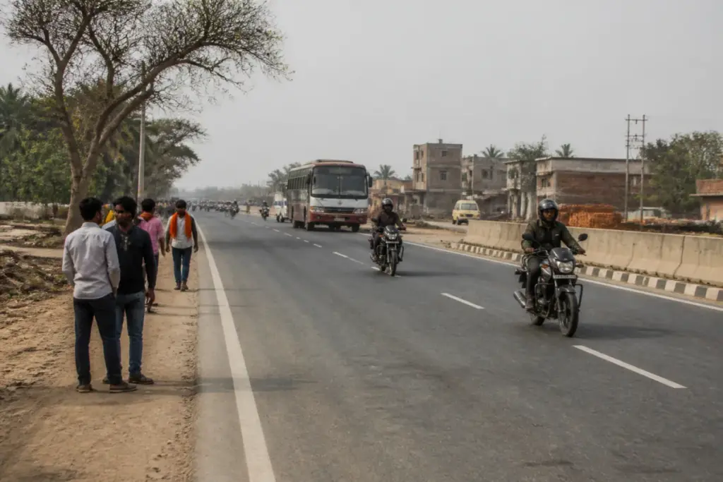 NH-922 highway near Buxar with traffic and pedestrians crossing the road