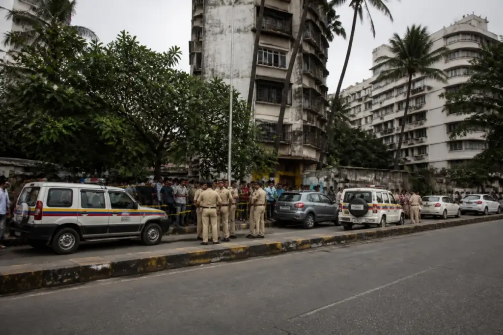 Police presence near the Juhu firing scene in Mumbai after a driver was injured.