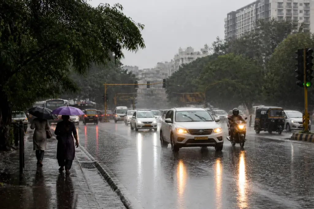 Bengaluru rain alert showing wet roads and monsoon clouds over the city