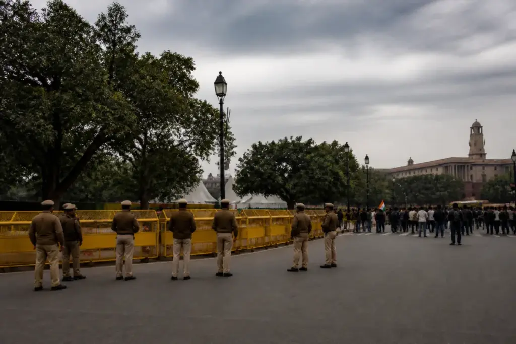Delhi protest detentions outside a police barricade near a central Delhi protest site