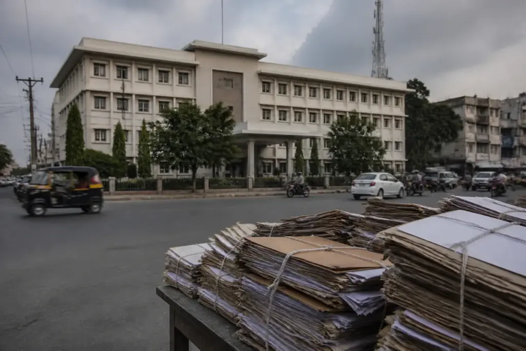 Ballari City Corporation corruption probe represented by a municipal building and Karnataka High Court documents