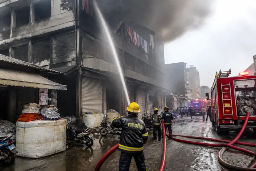 Firefighters responding to the Surat textile market fire at Adinath Textile Market