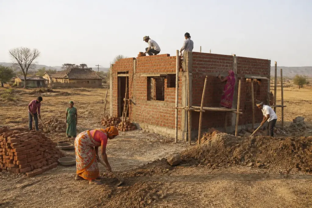 Nandurbar rural jobs workers building a house amid drought conditions in Maharashtra