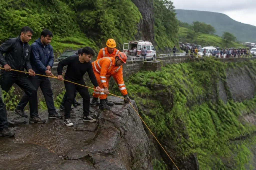 Tiger Point rescue workers helping people near a gorge in Lonavala