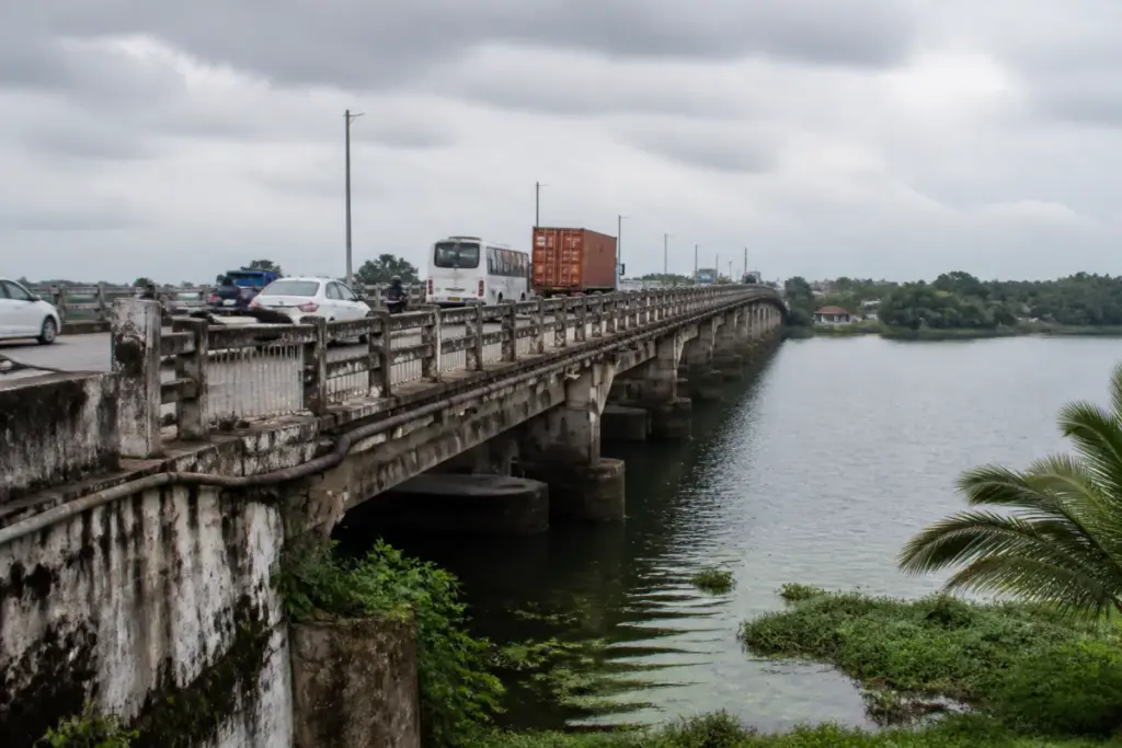 Cherai Bridge in Kochi showing ageing concrete and damaged approach-road walls