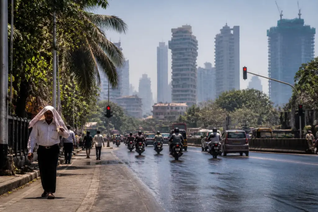 Mumbai temperature rising over a hot urban street under a bright afternoon sky