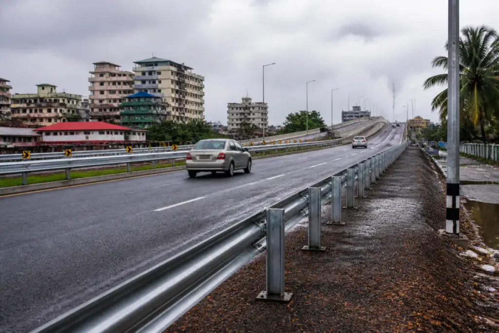 Crash barriers installed along the NH 66 Kochi bypass near an elevated bridge approach