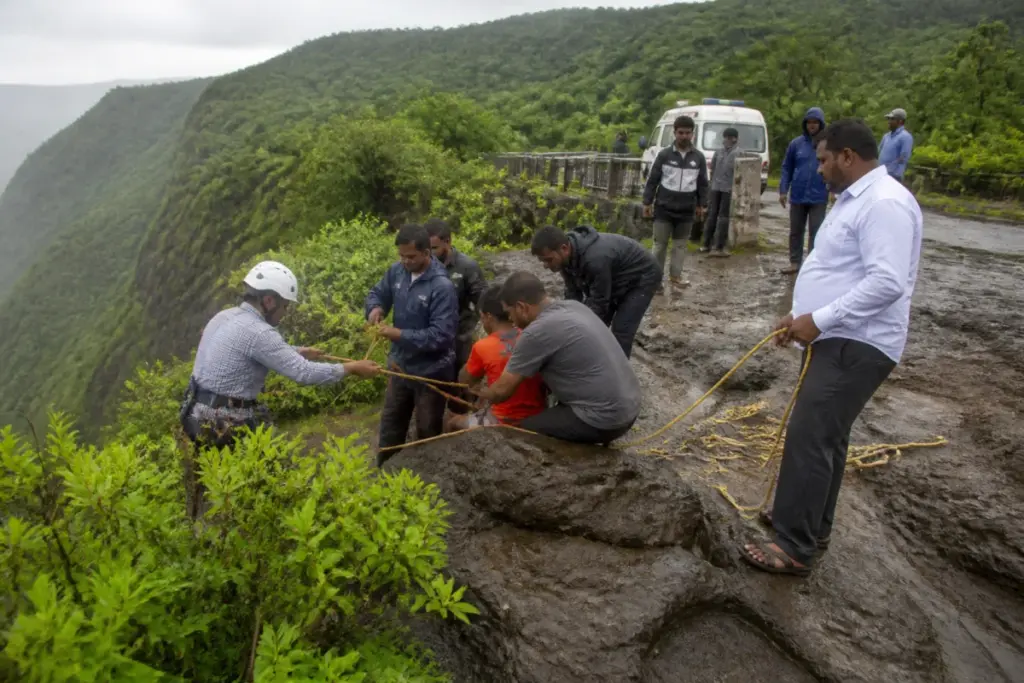 Tiger Point rescue workers assisting people near a gorge in Lonavala