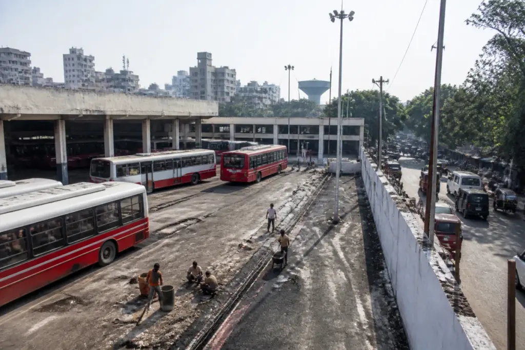 Pune PMPML buses parked near a city depot awaiting infrastructure upgrades