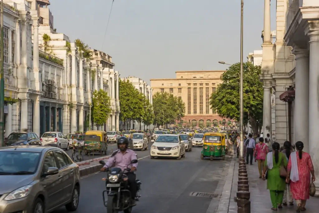 NDMC property tax reform represented by a central Delhi commercial street and municipal buildings
