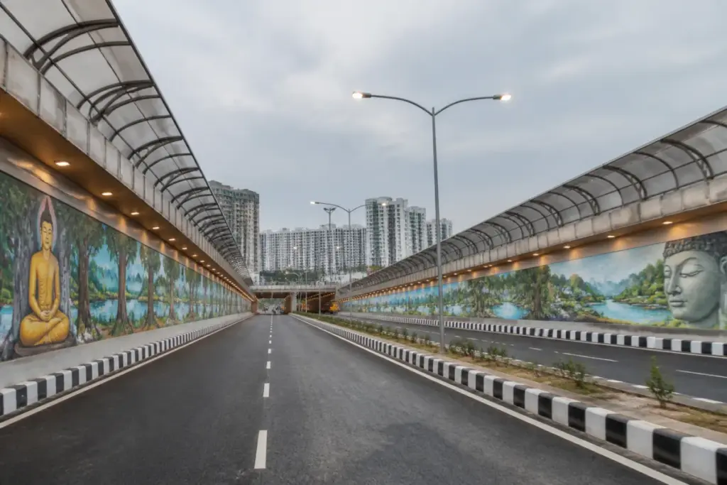 Gaur Chowk underpass in Greater Noida West with painted walls and finishing work underway