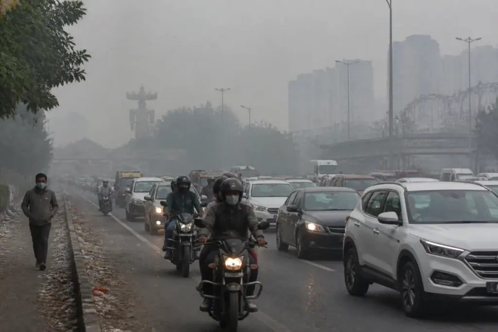 Delhi AQI pollution haze over a busy Delhi-NCR road after Dussehra celebrations