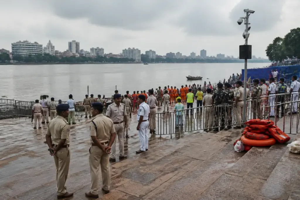 Kolkata Ganga ghats prepared for Dashami idol immersion with police and civic officials overseeing security.
