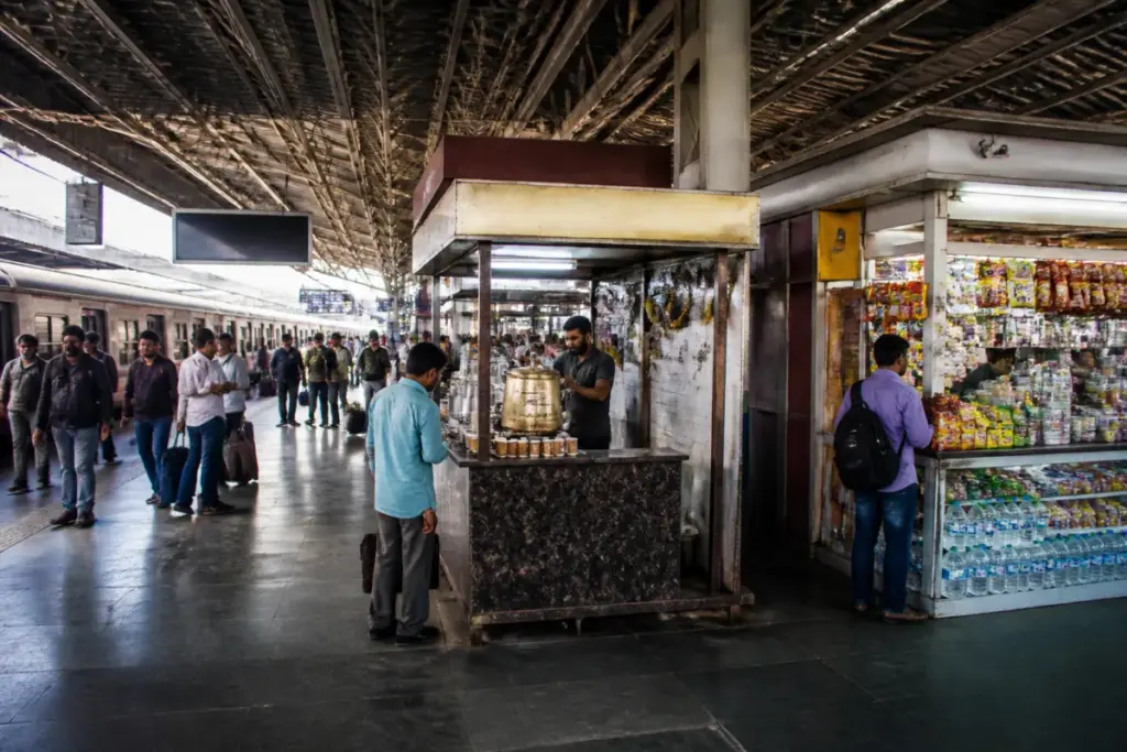 Pune railway station concourse with passenger food and retail stalls