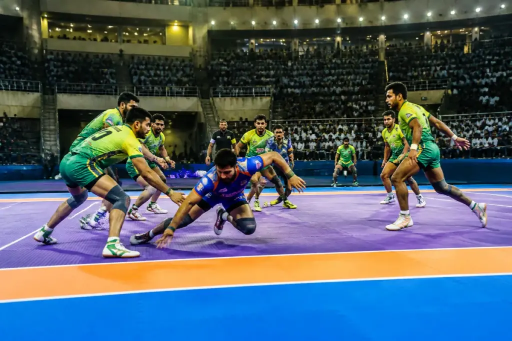 Commonwealth Kabaddi Championship players competing at an Ahmedabad sports venue