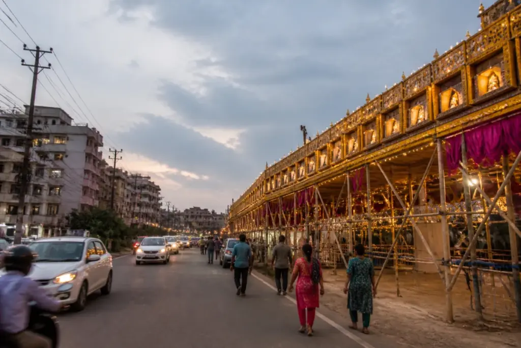 Festival pandal beside a Bhubaneswar public road with space kept open for traffic and emergency access