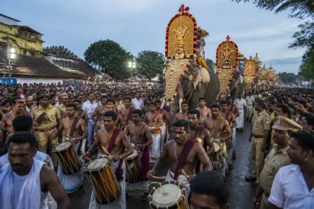 Thrissur Pooram procession with decorated elephants and crowds during the disputed festival event