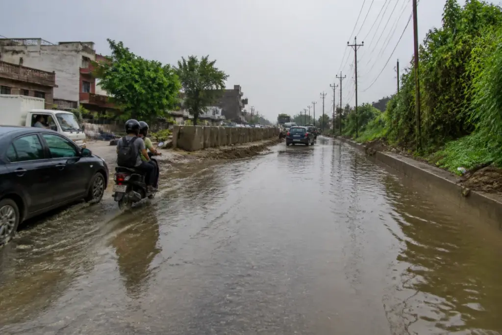 Chhatarpur waterlogging on a South Delhi road during monsoon rains