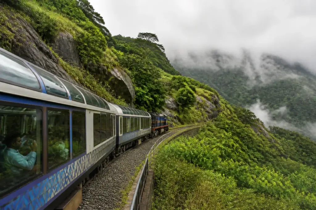 Vistadome coach travelling through the Western Ghats on the Kollam–Sengottai route