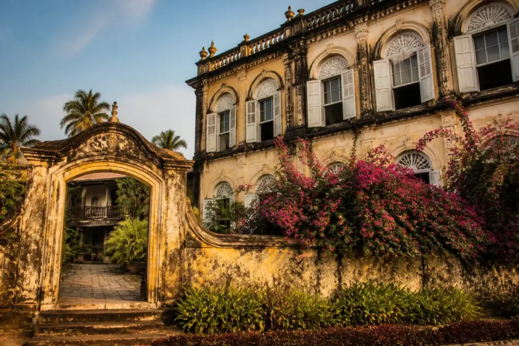 Figueiredo mansion in Loutolim, Goa, surrounded by bougainvillea and historic architectural details