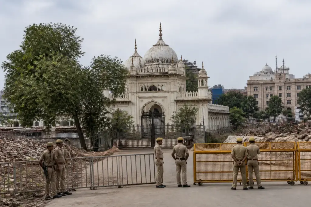 Race Course mosque in Delhi near a cleared site with police barricades and demolition debris