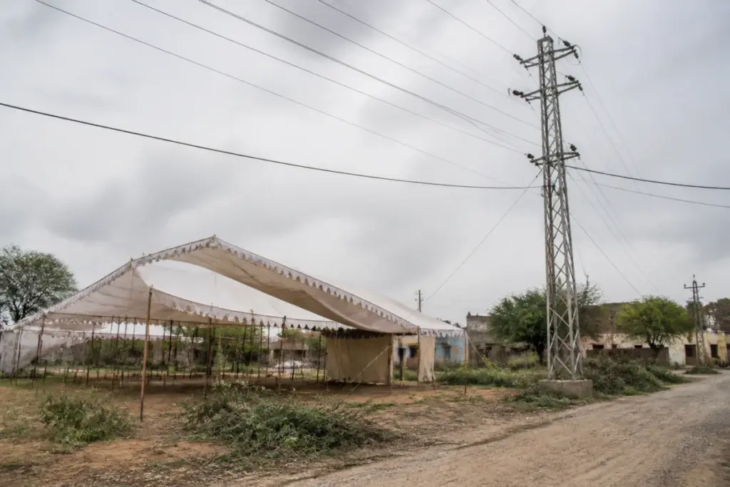 Pratapgarh electrocution site near a temporary meeting tent and overhead power lines