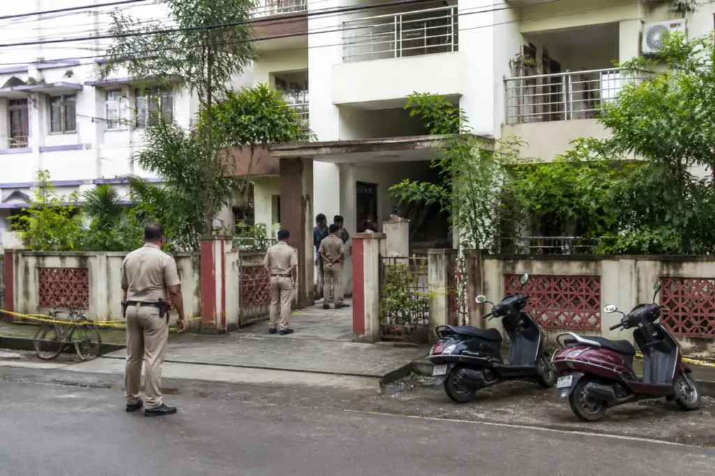 Police investigation outside a rented flat linked to the Guwahati woman death case