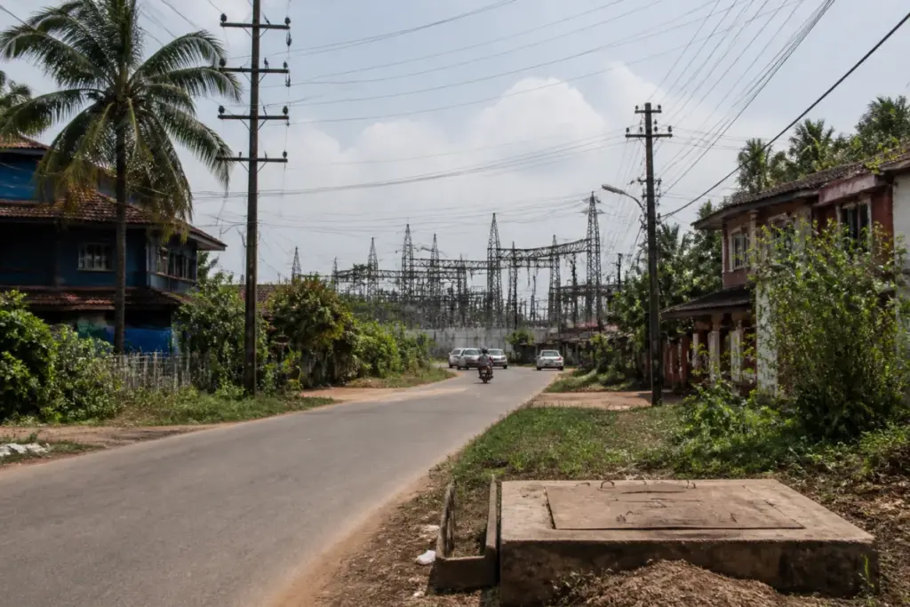 Benaulim power outages affecting a coastal Goa village with electricity poles and homes
