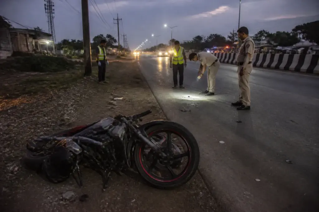 Chhattisgarh road accidents scene on a rural highway with police and emergency responders