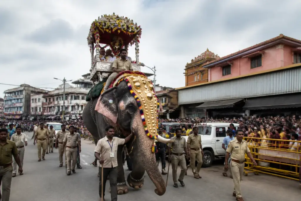 Shivamogga Dasara procession with a ceremonial elephant and crowded streets