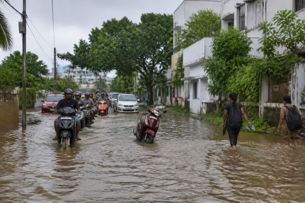 Puducherry rains flooding a low-lying urban road with traffic disrupted