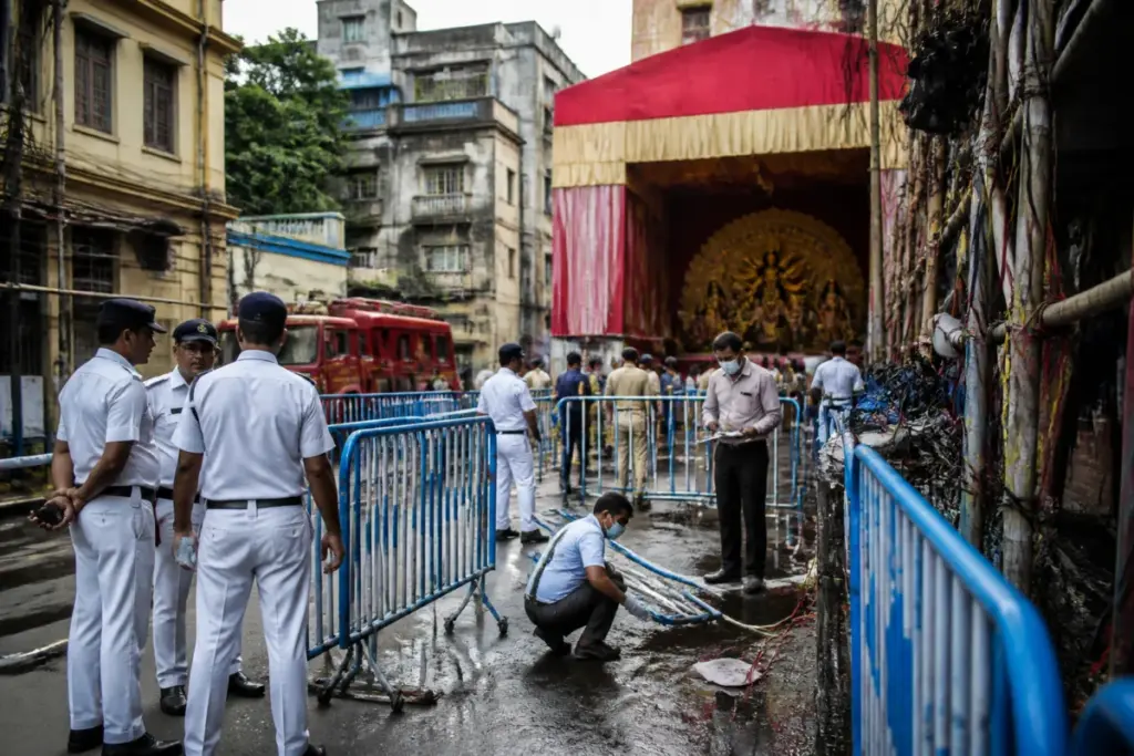 Kolkata stampede probe team examining a crowded Durga Puja pandal site
