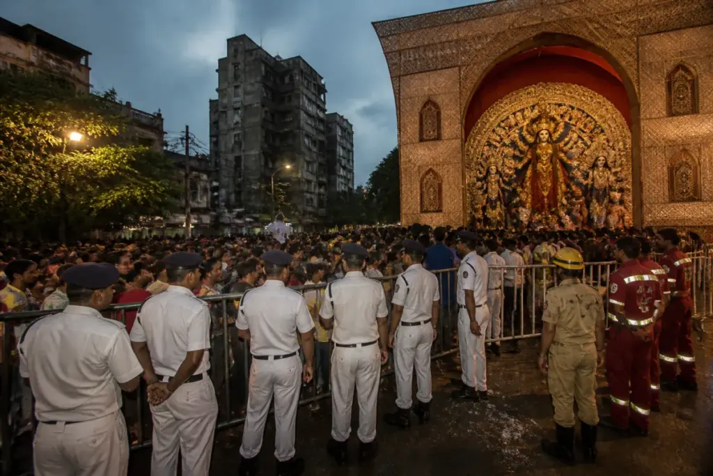 Kolkata stampede probe site outside a Durga Puja pandal with police managing crowds