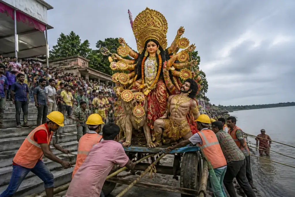 Tufanganj idol immersion accident at a river ghat involving municipal workers