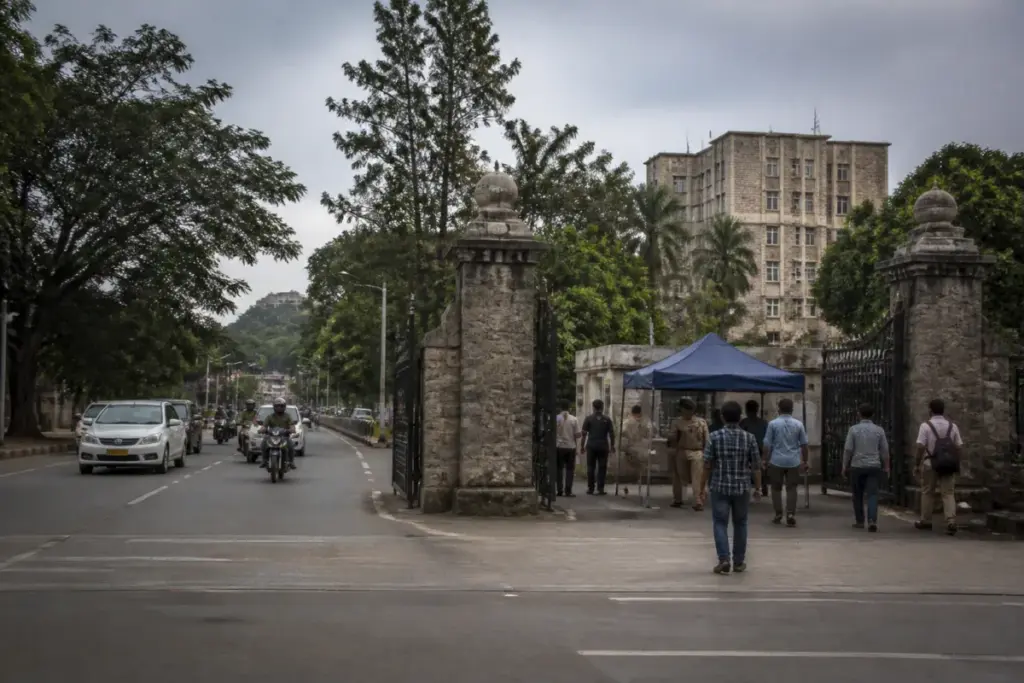 SPPU campus entry gate in Pune with security checks and university roads behind it