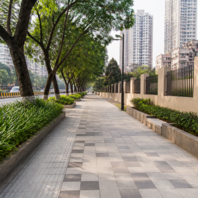 Urban pathway improvement project in Mumbai’s BMC S Ward showing paved footpath and city infrastructure